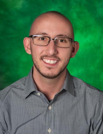 Anthony Vazquez headshot. He is wearing business professional attire.