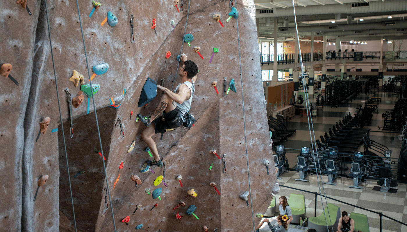 Student rock climbing at UNT's Pohl Recreation Center