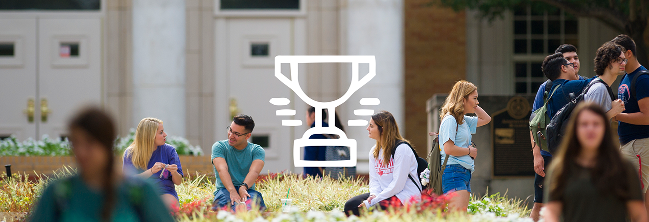 Students walking on campus with trophy icon over the photo