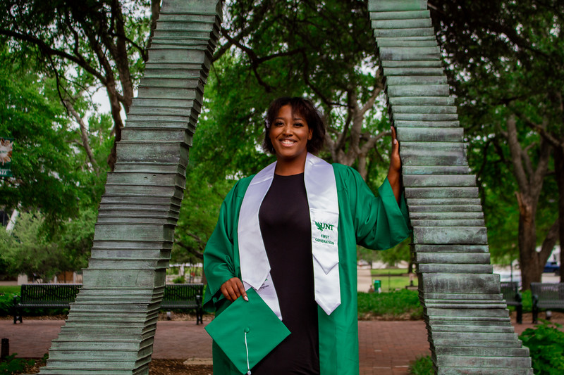 UNT Student Posing For A Graduation Photo