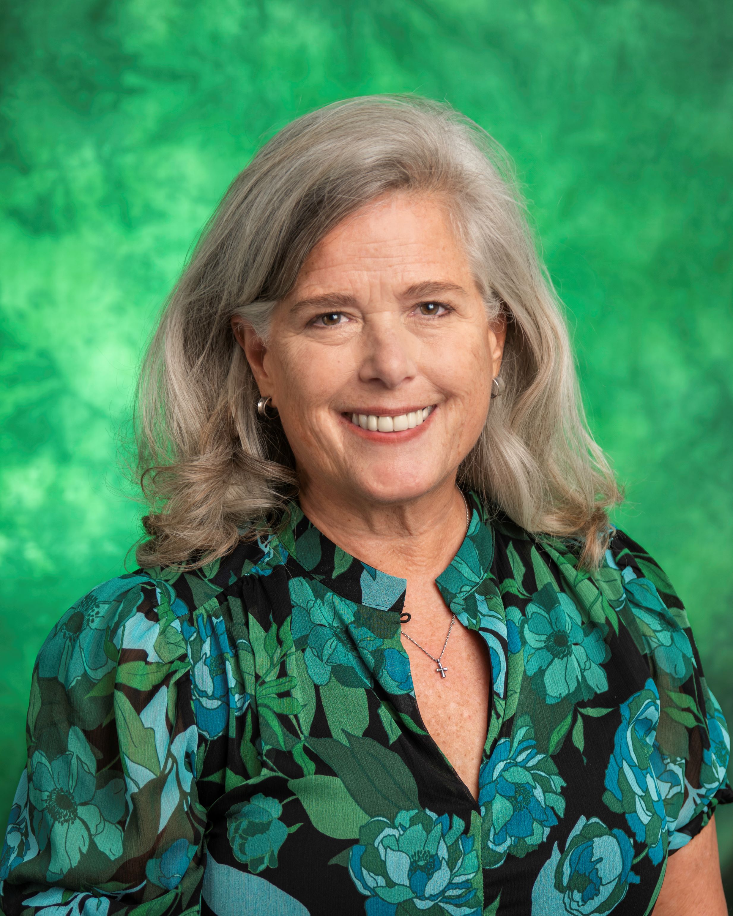 woman in green dress smiling