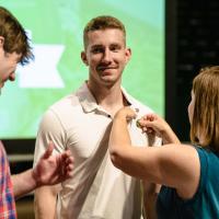 UNT student receiving pin from Legacy family