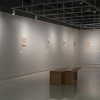 view of hanging prints on left wall 