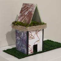 mixed media sculpture of a roofed building
