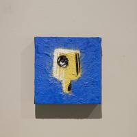 Blue painting with yellow abstract form in the center