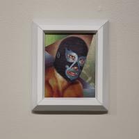 Small painting of person wearing a black and silver wrestling mask