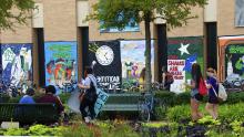 students in library mall with painted homecoming signs