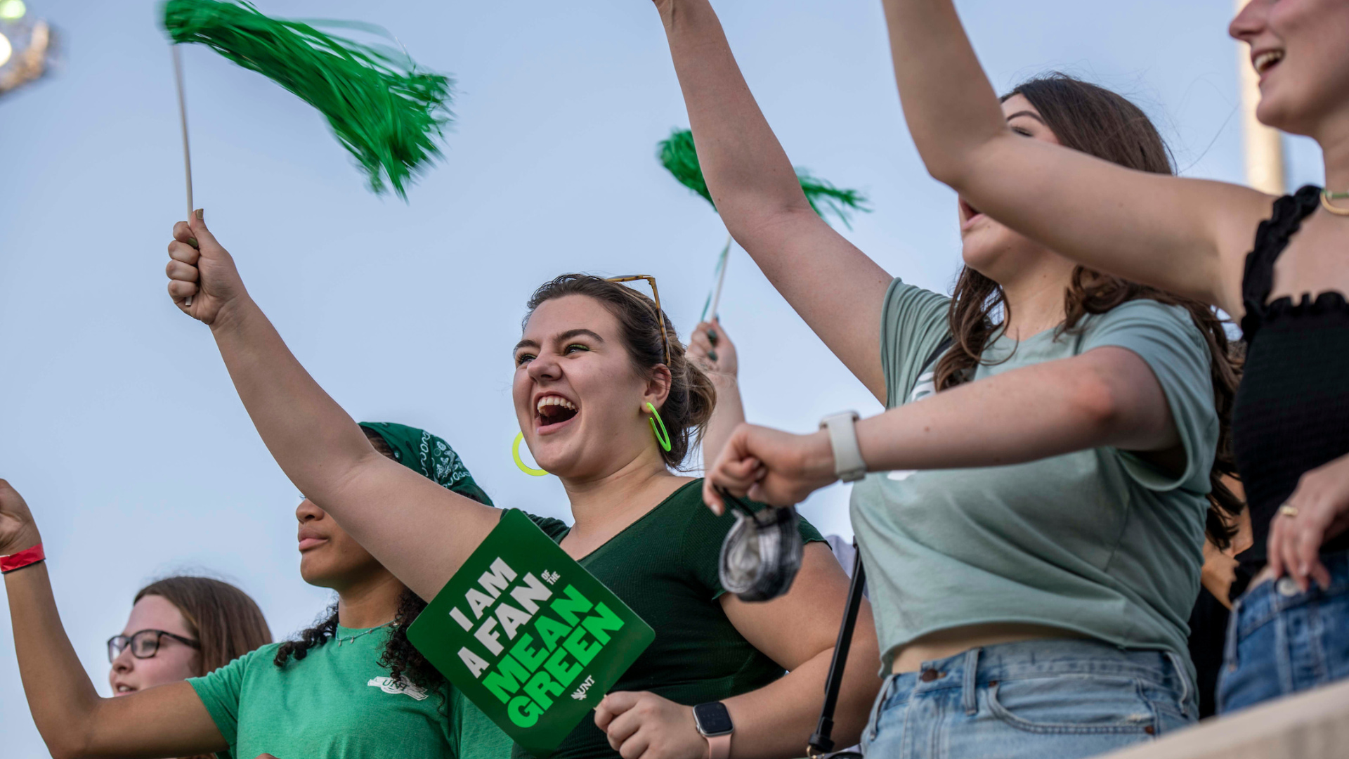 Students cheering at a football game