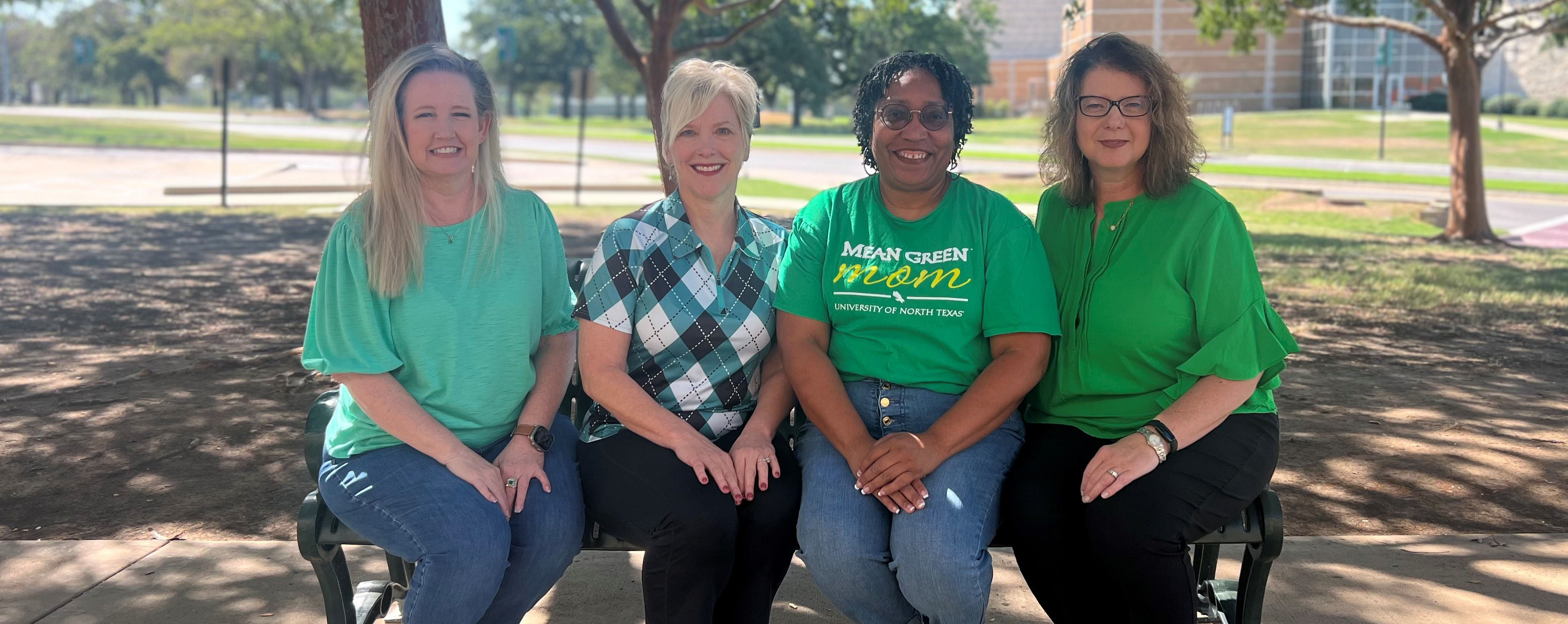 parent association executive board members sitting on a bench