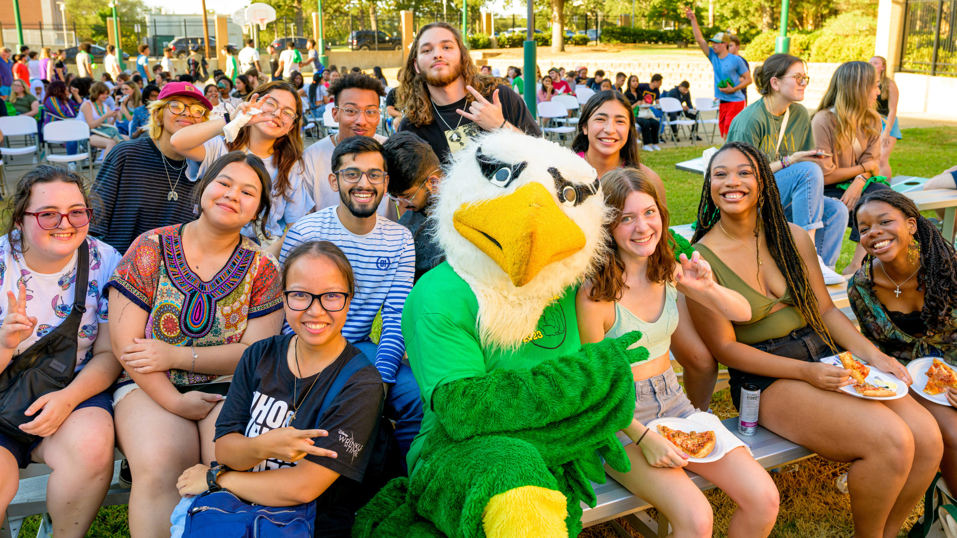 Group of students smiling in a photo with Scrappy at the REC Center