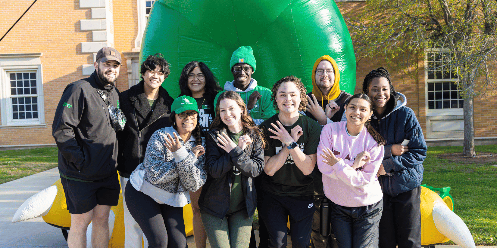 nt40 members infront of giant scrappy inflatable 