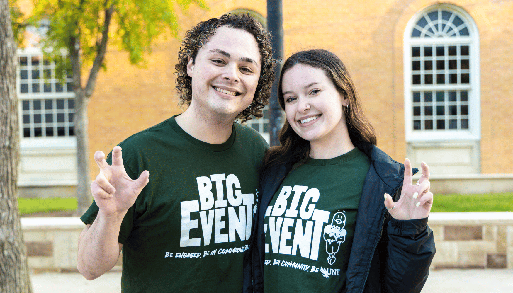 two people with eagle claw hand gesture