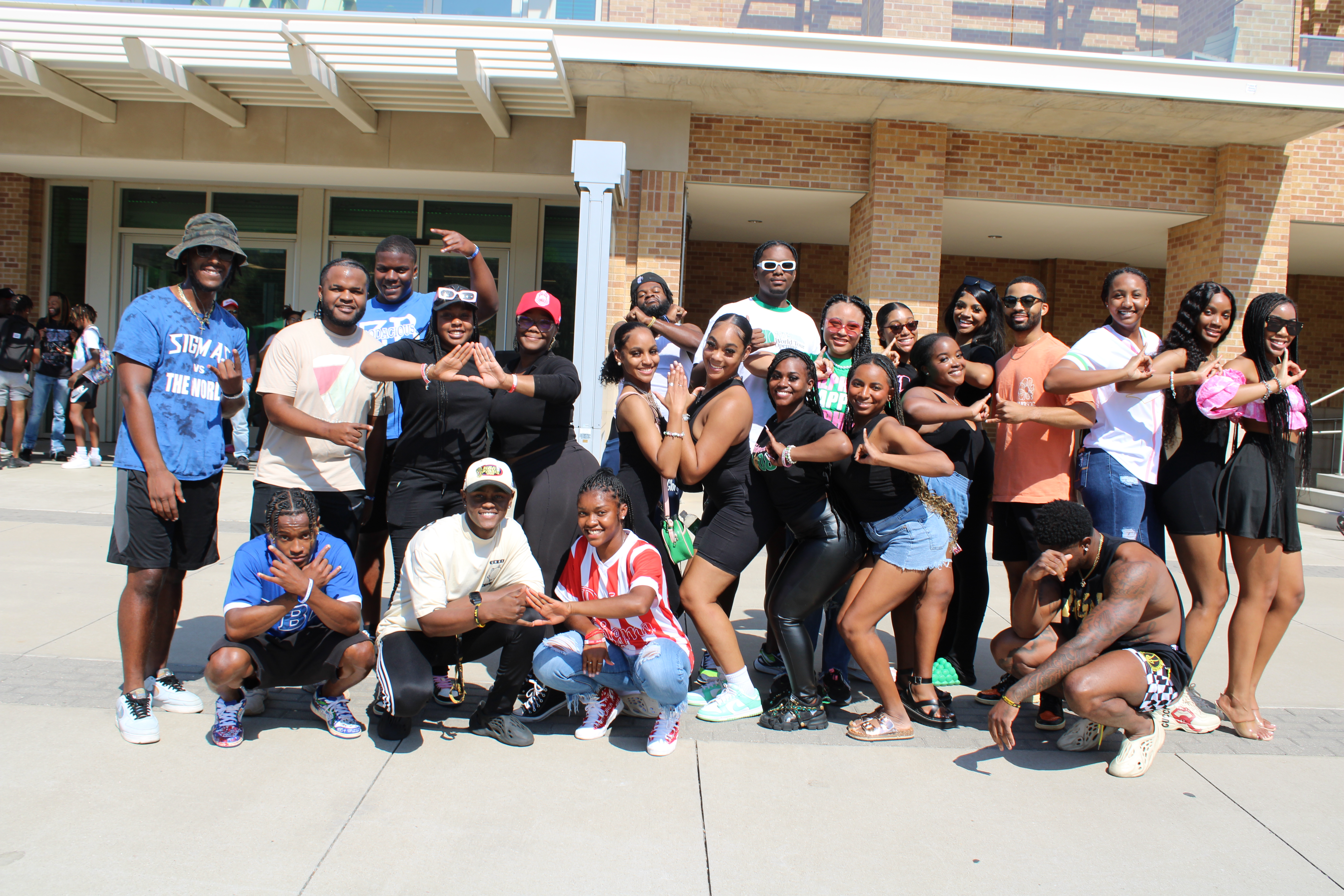 student talking to visitor at table