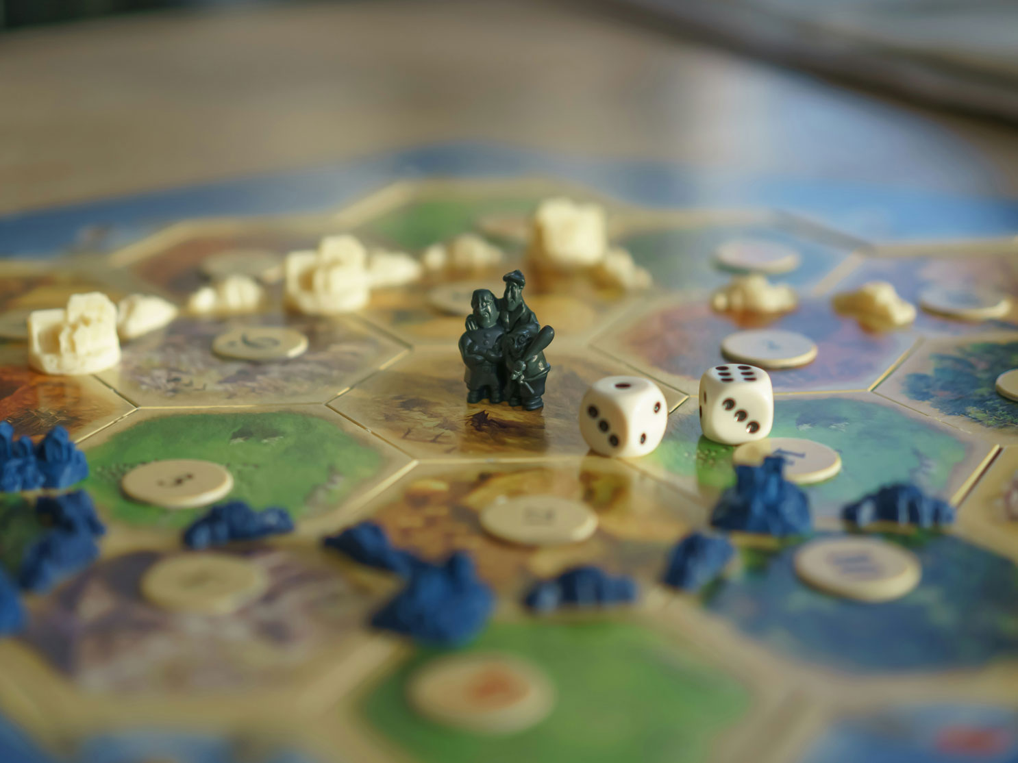 A game board of Catan is laid out