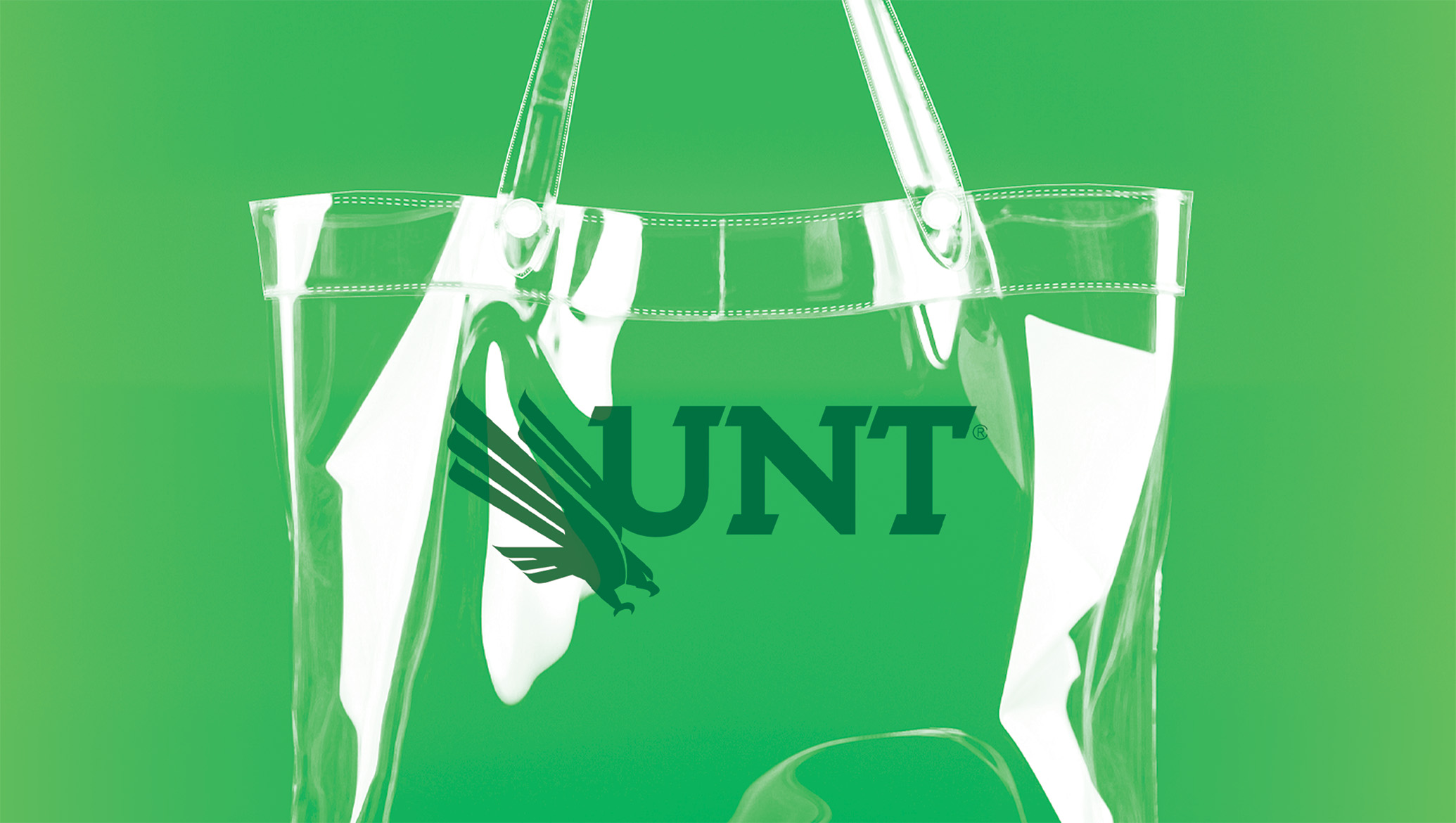 clear tote bag on a green background with the UNT logo