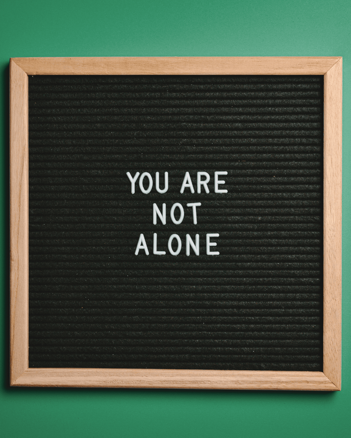 sign that reads "you are not alone"