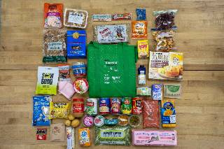 Image of a grocery bag with offerings from the food pantry
