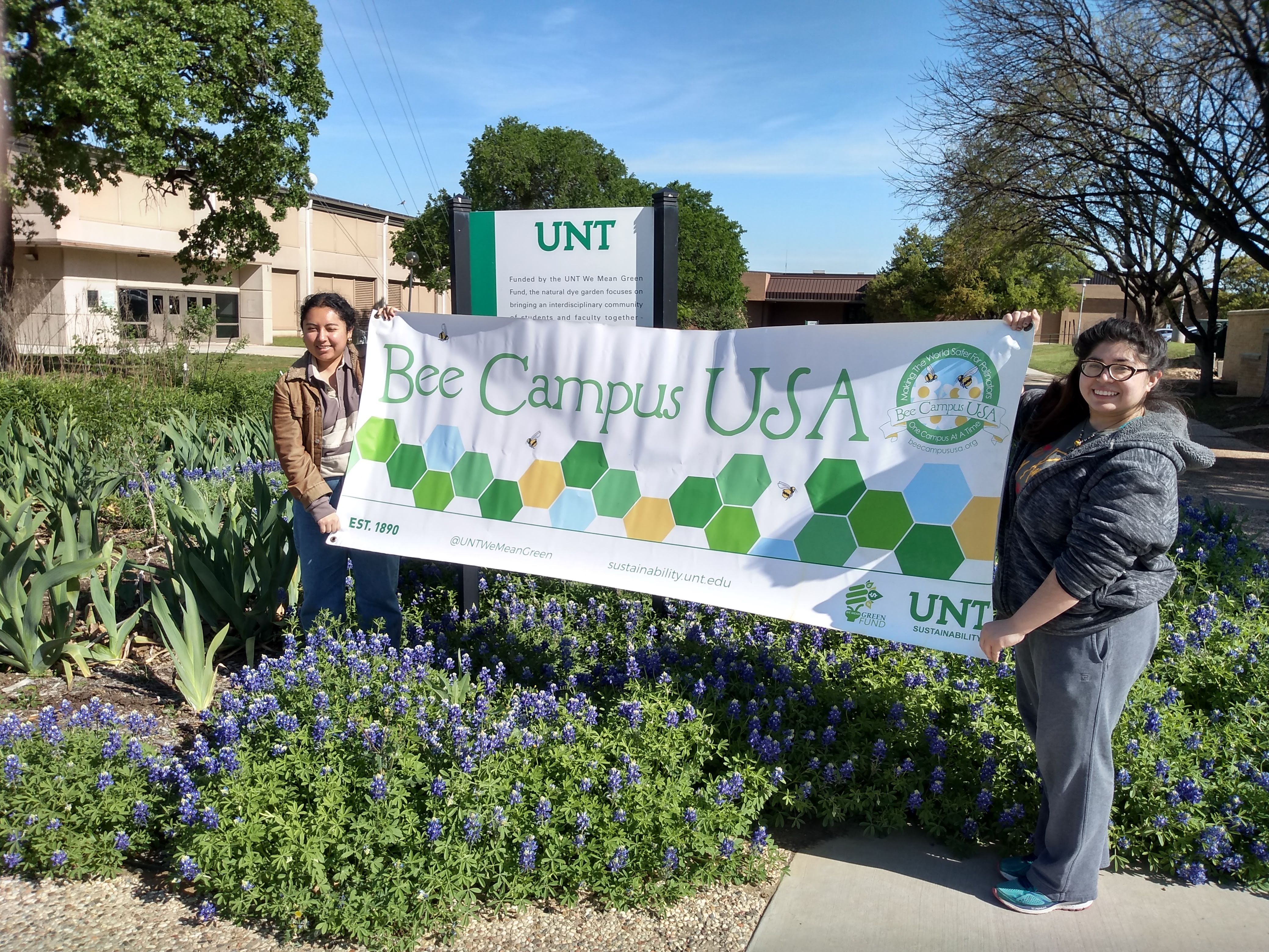 Image of students holding the UNT Bee Campus USA Banner
