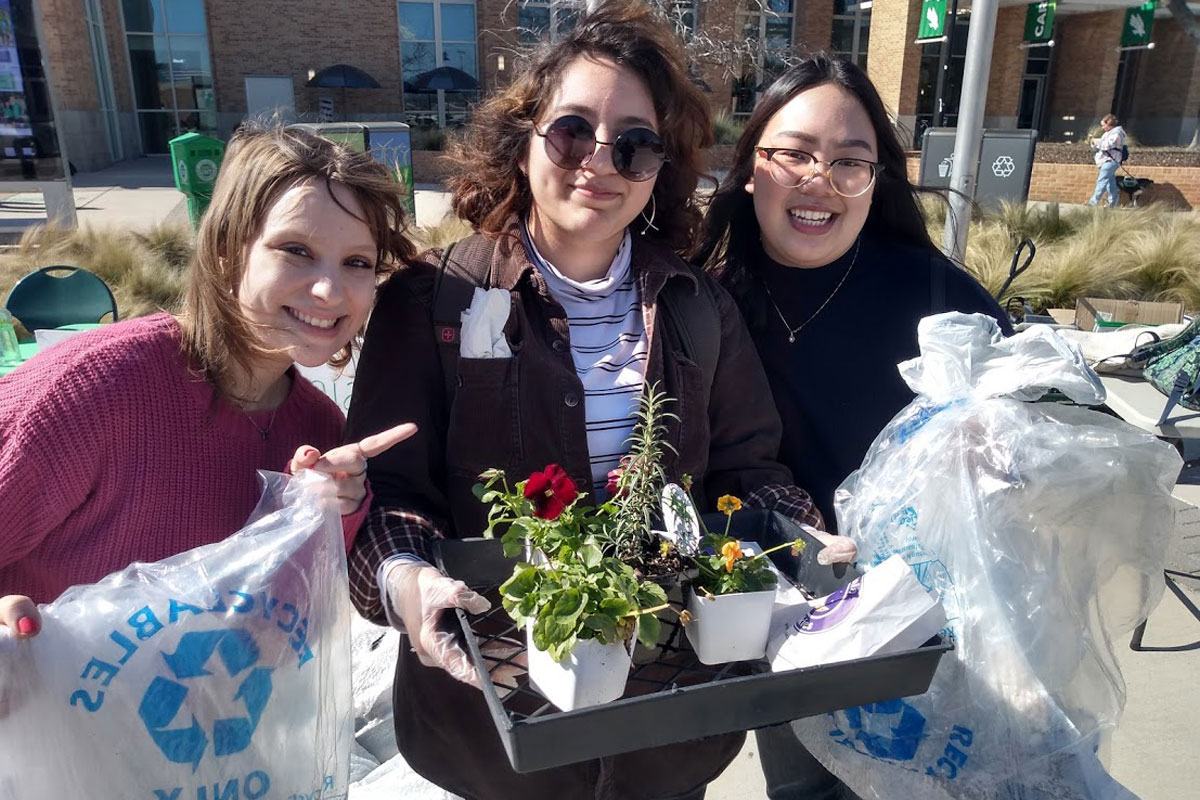 Image of students with reusable items and plants.