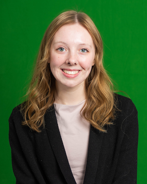 light blonde hair, green eyes, green background