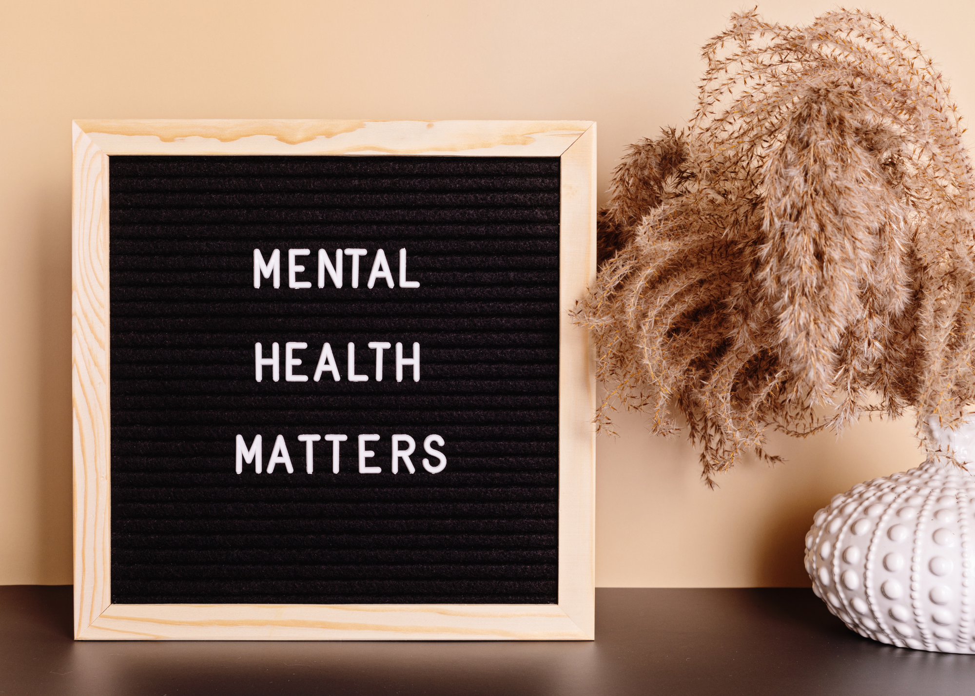 Photo of a message board on a table that says Mental Health Matters.