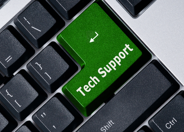 Computer keyboard with a green Tech Support Button.