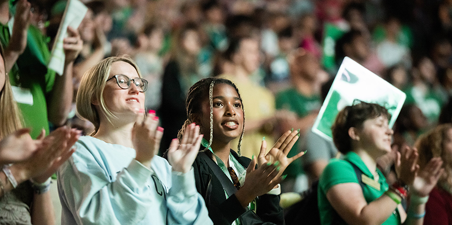 students clapping during the orientation welcome