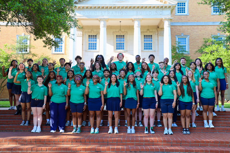 orientation leaders in front of Hurley Administration Building
