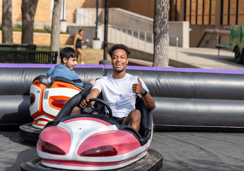 students in library mall on bumper cars