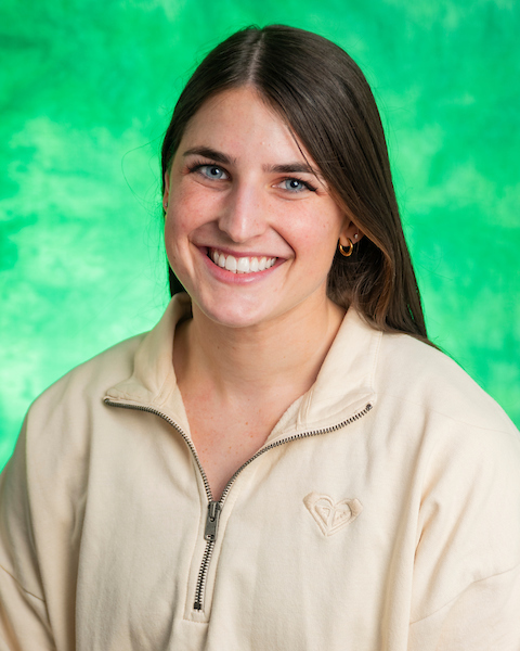 brown hair, green eyes, green background