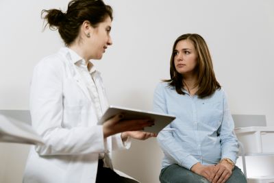 doctor talking with a female patient