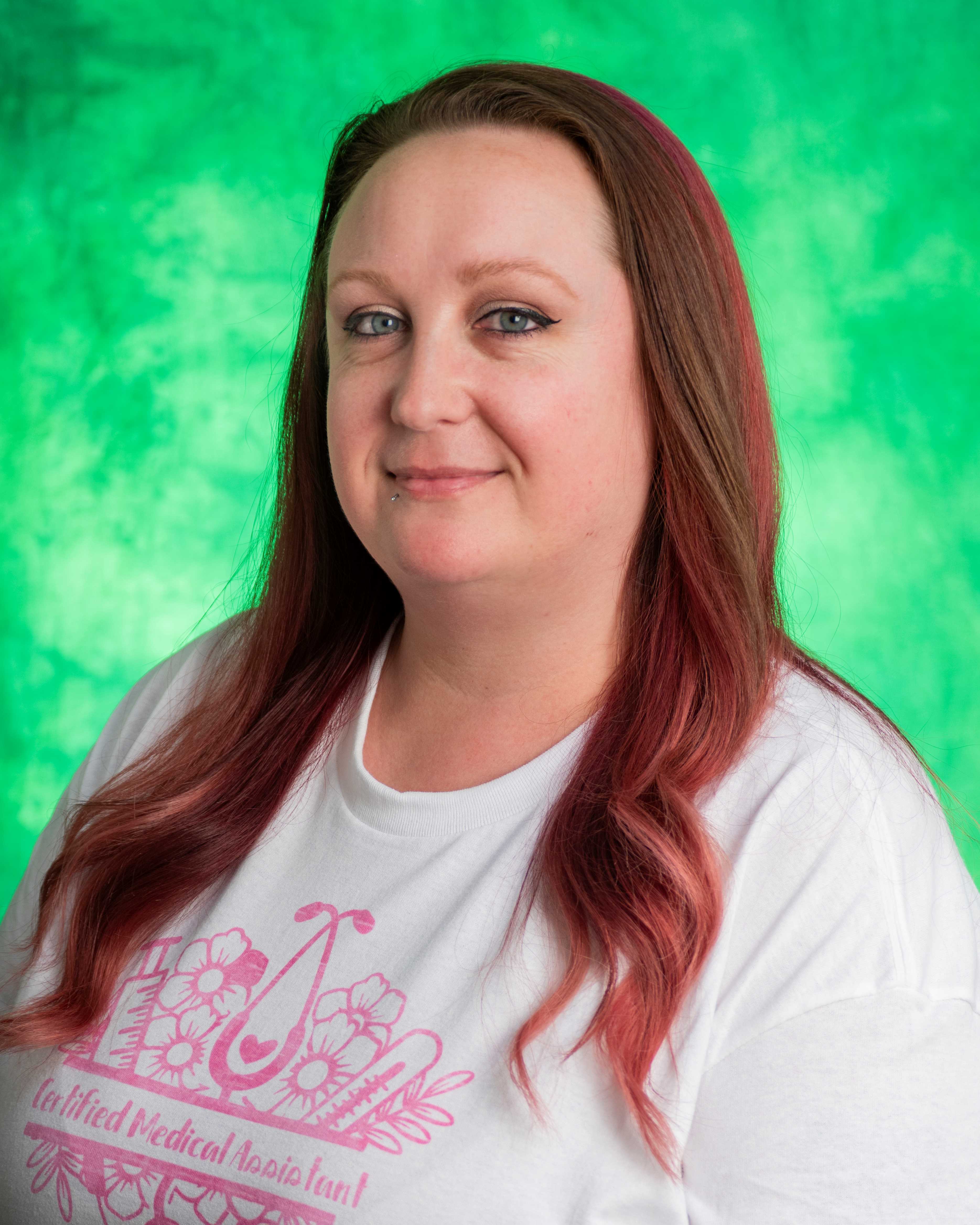 red hair, green eyes, green background