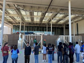 students watching build at expo