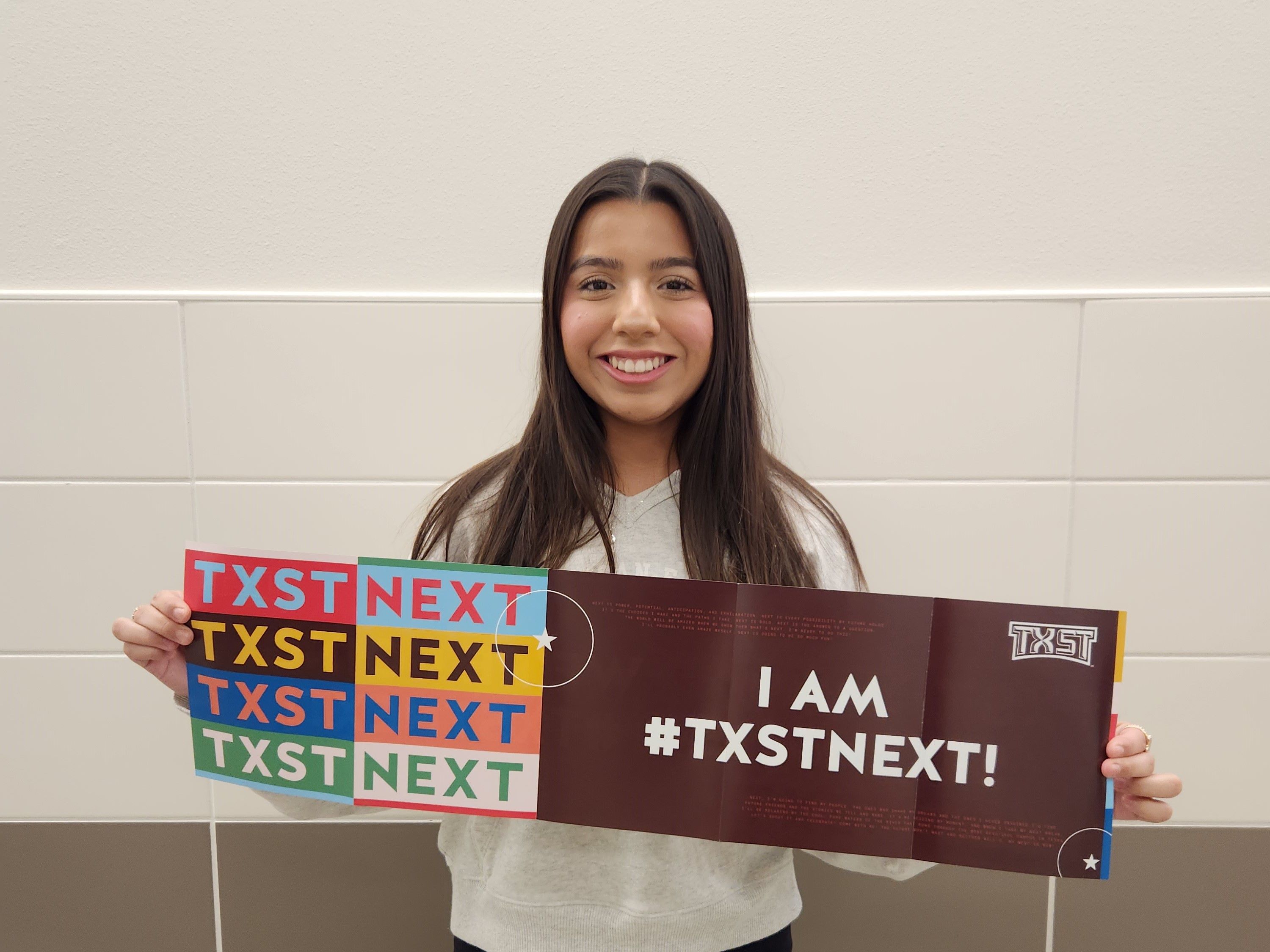 student displaying texas state banner