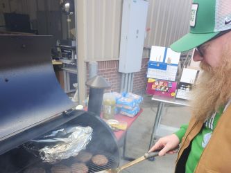 man grilling hamburgers