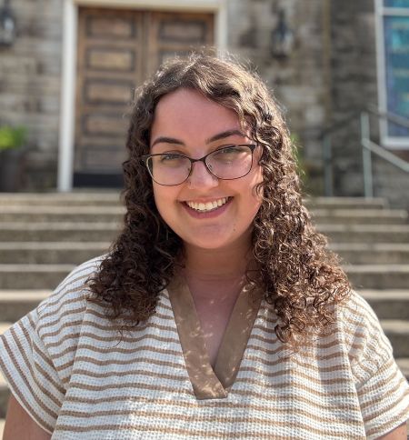 smiling woman with curly hair