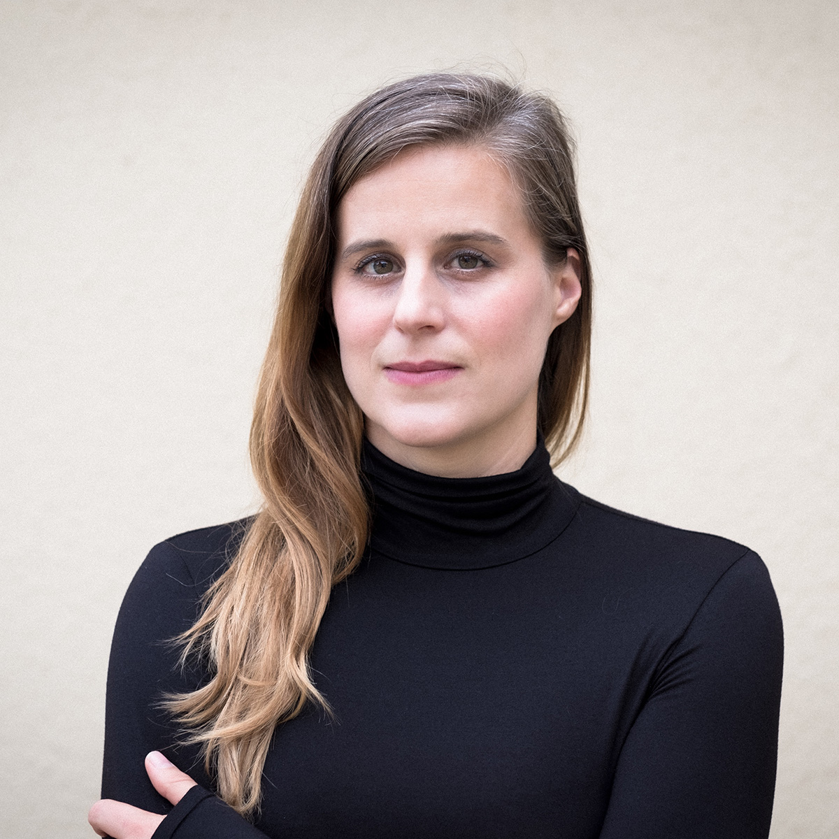 headshot of author lauren groff with long dirty blonde hair and a black shirt